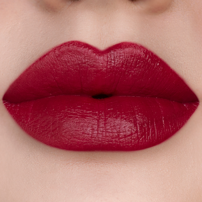 After 5 deep cherry red lipstick on lips, light skin tone